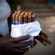 A woman sells cigars on the street in Havana on Dec. 20, 2014.
Lisette Poole/Bloomberg via Getty Images